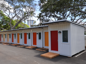 Photo of Pūlama Ola kauhale, the Governor’s medical respite community located in the parking lot of the Hawaiʻi State Department of Health. It provides a place for people experiencing homelessness to rest and recover after they have been discharged from hospitals.