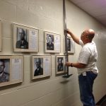 The photo above shows Stephen Lum putting up photos of all the Adjutants General who served in the State Department of Defense.