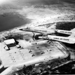 A photograph of three Hawai‘i Air National Guard F-102 Delta Daggers flying over their new hanger facilities in 1962.