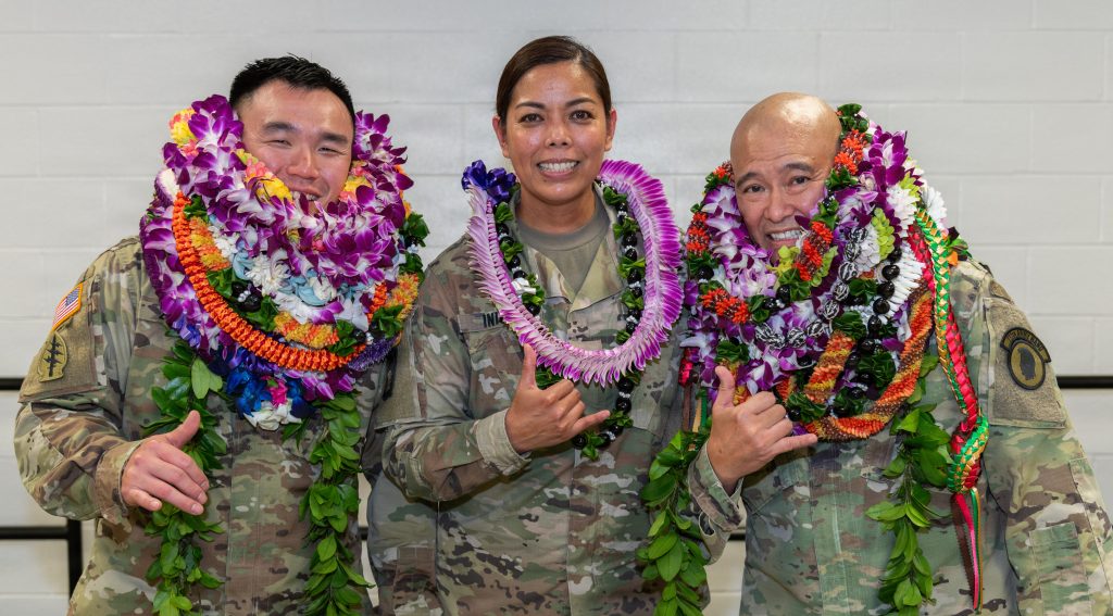 From left, U.S. Army Warrant Officer Clement K. Zhang, incoming commander of the 111th Army Band (111 AB), Col. Phoebe P. Inigo, commander of 103rd Troop Command, and Chief Warrant Officer 5 Curtis Y. Hiyane, outgoing commander of the (111 AB), pose for a photo after Hiyane’s retirement ceremony in Pearl City, Hawaii, Jan. 10, 2026. Hiyane concludes his military career after 43 years of service. (U.S. Army National photo by Staff Sgt. John Schoebel)