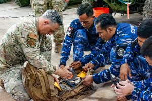 U.S. Air Force Master Sgt. Dustin Frey, 154th Explosive Ordnance Disposal flight technician, presents and reviews hook and line equipment to the Indonesian Air Force EOD on Andersen Air Force Base, Guam, July 21, 2026. Hawaii National Guard service members such as Frey routinely train with Indonesian Air Force counterparts through the State Partnership Program which aims to enhance disaster response, aviation, medical readiness, cybersecurity, and professional development between the partner nations. (U.S. Air National Guard photo by Senior Airman Roann Gatdula)