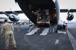 A C-17 Globemaster III, assigned to the 15th Wing, transported three Southern California Edison (SCE) utility trucks from March Air Reserve Base, Calif. as part of Operation TREK808, to Hilo International Airport, Hawaii, on Aug. 24, 2026. The utility trucks arrived to support the Hawaiian Electric Company (HECO) power restoration efforts following Hurricane Lala on Hawaiʻi Island where thousands of homes remained without electricity after the hurricane impacted the state Aug. 14-16, 2026. Operation TREK808 was made possible through coordination among Hawaiʻi Gov. Josh Green, the Hawaiʻi National Guard, Department of War, U.S. Pacific Command, Pacific Air Forces, SCE and HECO. The operation demonstrates the collaborative efforts of state, federal and utility partners to restore critical infrastructure following a natural disaster. (U.S. Army National Guard photo by Spc. Daniel Barcenas)