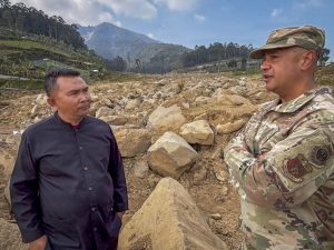 Nur Awaludin Lubis, head official of Pasirlangu Village, and U.S. Air Force Brig. Gen. Phillip L. Mallory, commander of the Hawaii Air National Guard, speak at an area of the village affected by a January 2026 landslide during a humanitarian assistance and disaster relief site survey conducted as part of Super Garuda Shield 2026 near Bandung, Indonesia, Sept. 3, 2026. Super Garuda Shield is an annual exercise between the Indonesian National Armed Forces and U.S. military designed to strengthen bilateral interoperability, capabilities and cooperation. (U.S. Air National Guard photo by Tech. Sgt. Orlando Corpuz)