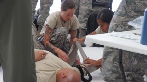 Airmen from the Hawaii Air National Guard practice lifesaving skills during the hands on portion of self-aid and buddy care training during August's unit training assembly, Aug. 9, 2015, Joint Base Pearl Harbor-Hickam. (U.S. Air National Guard Photo by Tech. Sgt. Andrew Jackson)