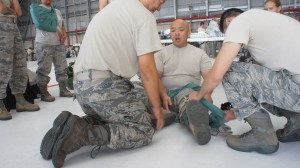 Airmen from the Hawaii Air National Guard practice lifesaving skills during the hands on portion of self aid and buddy care training during August's unit training assembly, Aug. 9, 2015, Joint Base Pearl Harbor-Hickam. (U.S. Air National Guard Photo by Tech. Sgt. Andrew Jackson)
