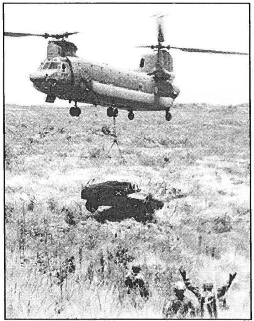 RECOVERY MISSION – A CH-47D Chinook helicopter from Co. C (Medium Lift), 193rd Aviation, airlifts a 29th Separate Infantry Brigade humvee to the Pohakuloa Training Area motor pool. Maj. R. Scott Rhode photo