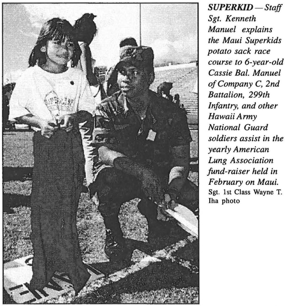 SUPERKID – Staff Sgt. Kenneth Manuel explains the Maui Superkids potato sack race course to 6-year-old Cassie Bal. Manuel of Company C, 2nd Battalion, 299th Infantry, and other Hawaii Army National Guard soldiers assist in the yearly American Lung Association fund-raiser held in February on Maui. Sgt. 1st Class Wayne T. Iha photo