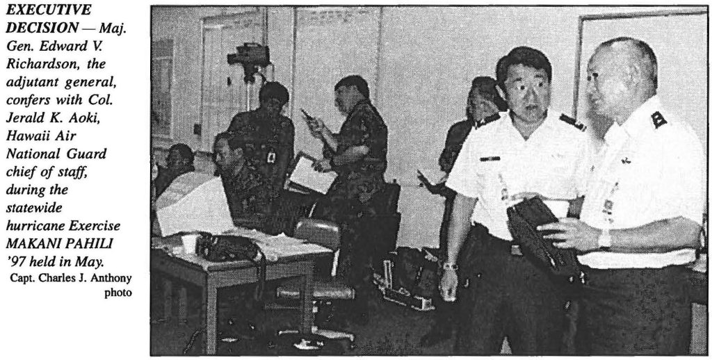 EXECUTIVE DECISION - Maj. Gen. Edward V. Richardson, the adjutant general, confers with Col. Jerald K. Aoki, Hawaii Air National Guard chief of staff, during the statewide hurricane Exercise MAKANI PAHILI '97 held in May. Capt. Charles J. Anthony photo