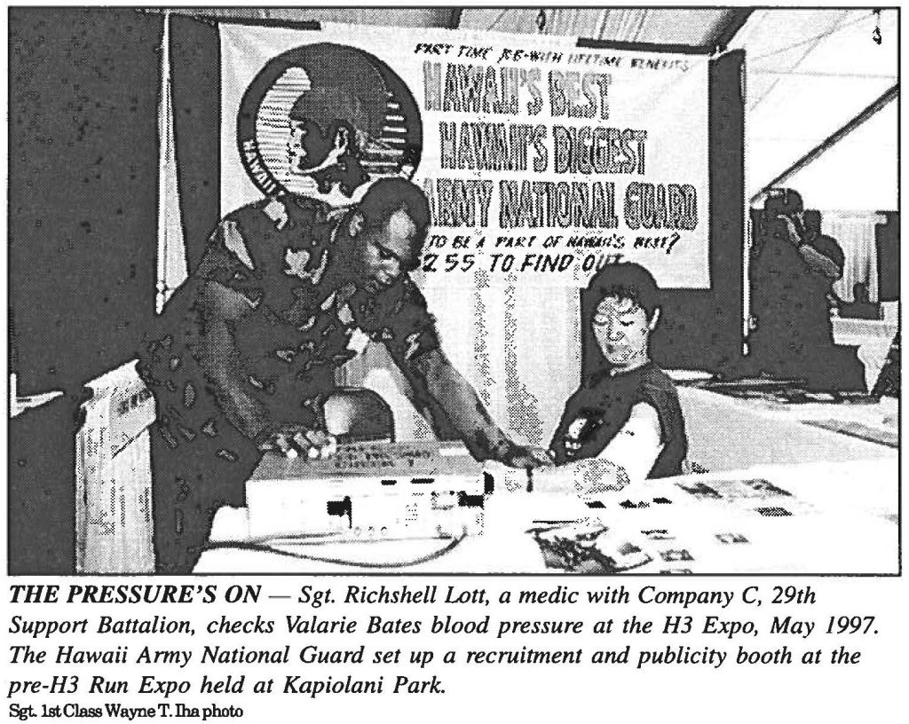 THE PRESSURE'S ON - Sgt. Richshell Lott, a medic with Company C, 29th Support Battalion, checks Valarie Bates blood pressure at the H3 Expo, May 1997. The Hawaii Army National Guard set up a recruitment and publicity booth at the pre-H3 Run Expo held at Kapiolani Park. Sgt. 1st Class Wayne T. Iha photo