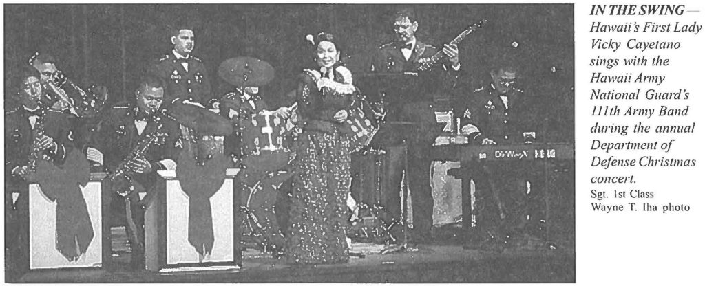 IN THE SWING Hawaii’s First lady Vicky Cayetano sings with the Hawaii Army National Guards 111th Army Band during the annual Department of Defense Christmas concert. Sgt. 1st Class Wayne T. Iha photo