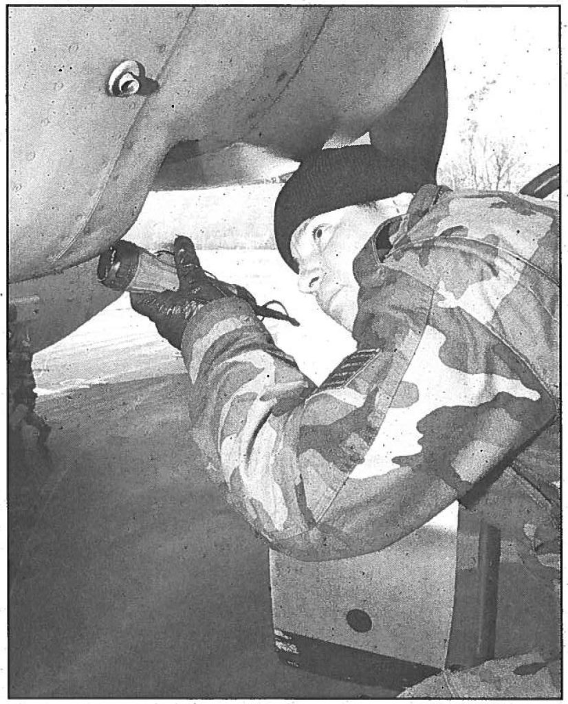 FINAL PRE-FLIGHT CHECK - A staff sergeant with the 203rd Air Refueling Squadron surveys the KC-135R Stratotanker before its mission in support of Operation ALLIED FORCE in March 1999. Staff Sgt. Mark Sindorig photo