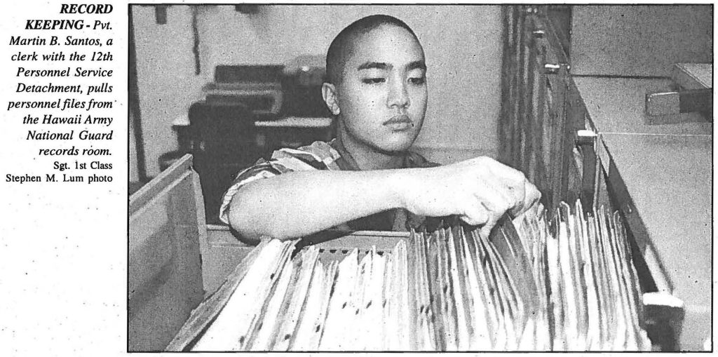 RECORD KEEPING- Pvt. Martin B. Santos, a clerk with the 12th Personnel Service Detachment, pulls personnel files from the Hawaii Army National Guard records room. Sgt. 1st Class Stephen M. Lum photo