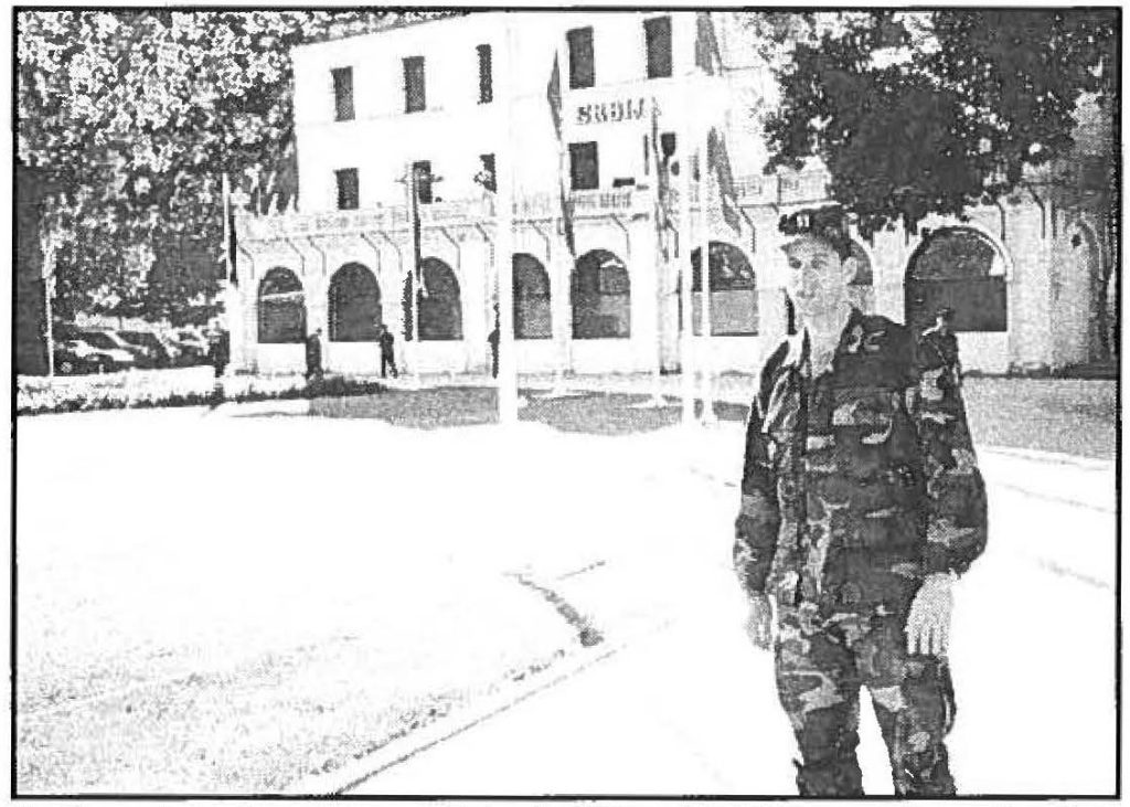 SEASONS GREETINGS -Capt. Marc Lawton exits Eagle Base headquarters in Tuzla, Bosnia-Herzegouina. During his eight-month tour as intelligence officer, Lawton was able to visit historic places such as the Srjija Hotel in Sarajeuo. The hotel is where the Archduke of Austria was assassinated, June 28, 1914, fueling the beginning of World War I.