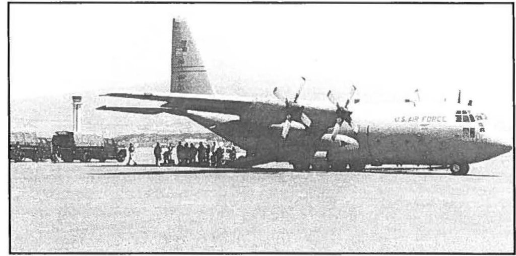 AIR BUSTING - A California Air National Guard C-130 Hercules aircraft transports government officials, detainees, and equipment from Kahului Airport, Maui to Oahu in support of Operation POWERBALL, a drug enforcement mission. Capt. Charles J. Anthony photo