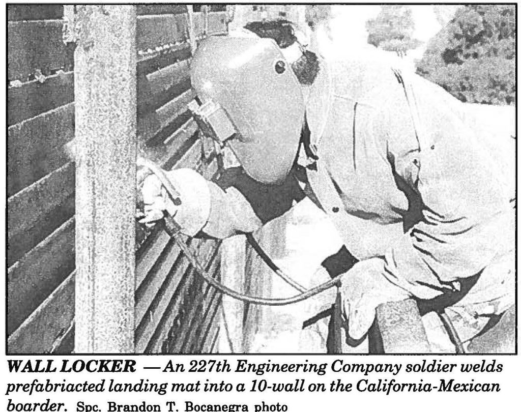 WALL LOCKER -An 227th Engineering Company soldier welds prefabricated landing mat into a IO-wall on the California-Mexican boarder. Spc. Brandon T. Bocanegra photo