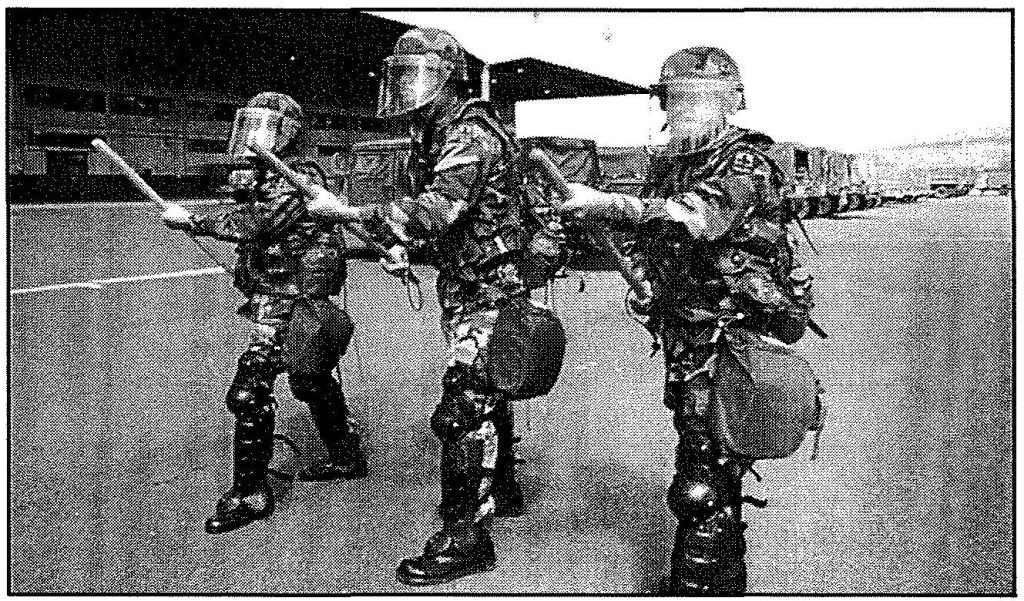 BEST FOOT FORWARD Specialists Rylan T. Ulep, YuanChyiong, and Marlo A. Cabigon, from Company B, 29th Support Battalion, practice a riot control stance at Kalaeloa. Sgt. Lance M. Kamisugi photo