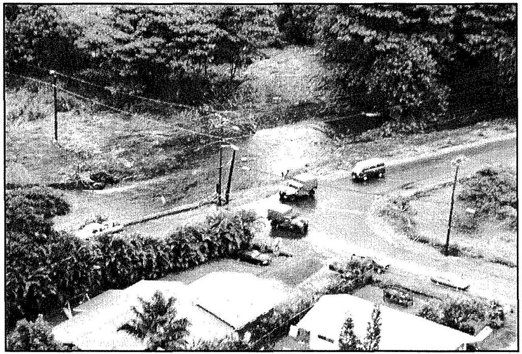 TRAFFIC CONTROL Hawaii National Guard vehicles detour traffic around roads damaged from the November 2000 Hilo flood. Sgt. 1st Class Wayne T. Iha photo