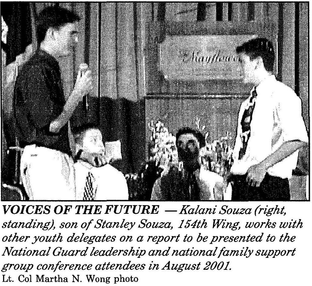 VOICES OF THE FUTURE -Kalani Souza (right, standing), son of Stanley Souza, 154th Wing, works with other youth delegates on a report to be presented to the National Guard leadership and national family support group conference attendees in August 2001. Lt. Col Martha N. Wong photo