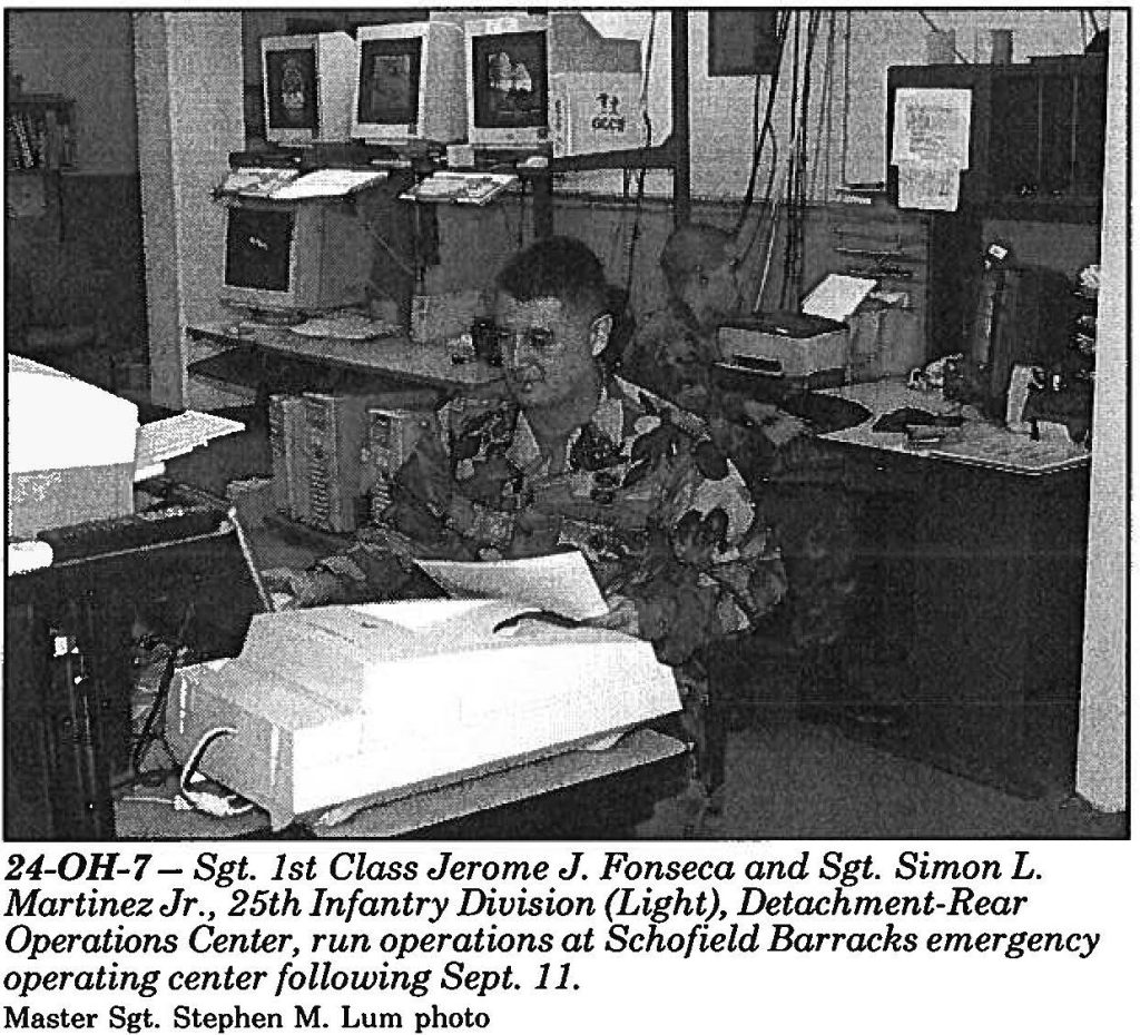 24-0H-7 - Sgt. 1st Class Jerome J. Fonseca and Sgt. Simon L. Martinez Jr., 25th Infantry Division (Light), Detachment-Rear Operations Center, run operations at Schofield Barracks emergency operating center following Sept. 11. Master Sgt. Stephen M. Lum photo