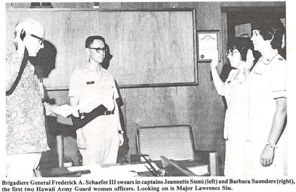 Brigadiere General Frederick A. Schaefer III swears in captains Jeannette Sumi (left) and Barbara Saunders(right), the first two Hawaii Army Guard women officers. Looking on is Major Lawrence Siu.
