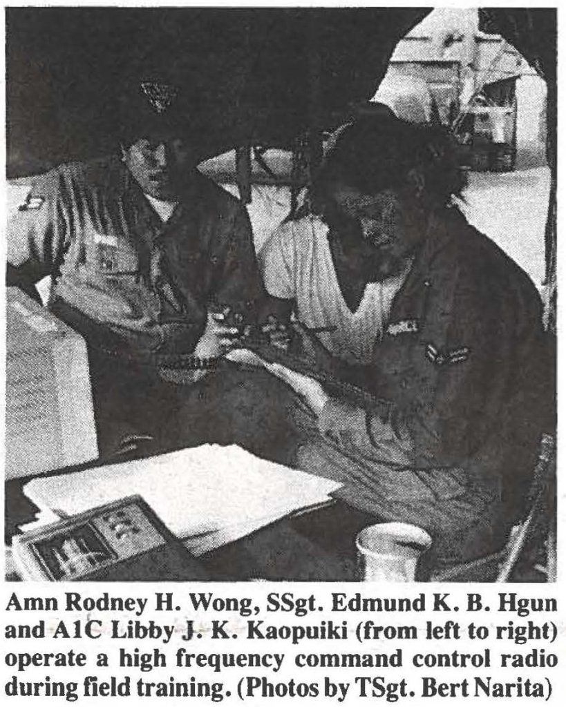 Amn Rodney H. Wong, SSgt. Edmund K. B. Hgun and AlC Libby J. K. Kaopuiki (from left to right) operate a high frequency command control radio during field training. (Photos by TSgt. Bert Narita)