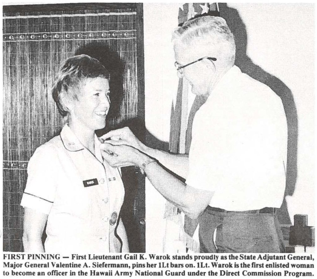 FIRST PINNING - First Lieutenant Gail K. Warok stands proudly as the State Adjutant General, Major General Valentine A. Siefermann, pins her 1Lt bars on. 1Lt. Warok is the first enlisted woman to become an officer in the Hawaii Army National Guard under the Direct Commission Program.