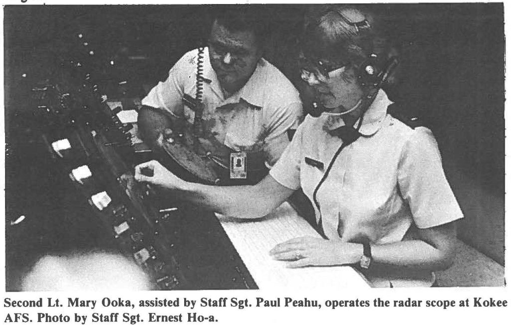 Second Lt. Mary Ooka, assisted by Staff Sgt. Paul Peahu, operates the radar scope at Kokee AFS. Photo by Staff Sgt. Ernest Ho-a
