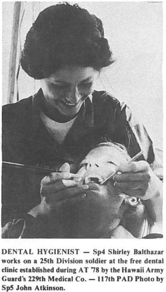 DENTAL HYGIENIST - Sp4 Shirley Balthazar works on a 25th Division soldier at the free dental clinic established during AT '78 by the Hawaii Army Guard's 229th Medical Co. - 1171h PAD Photo by Sp5 John Atkinson.