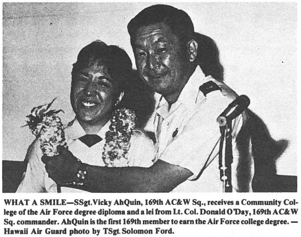 WHAT A SMILE- SSgt. Vicky AhQuin, 169th AC&W Sq., receives a Community College of the Air Force degree diploma and a lei from Lt. Col. Donald O 'Day, 169th AC&W Sq. commander. AhQuin is the first 169th member to earn the Air Force college degree. - Hawaii Air Guard photo by TSgt. Solomon Ford.