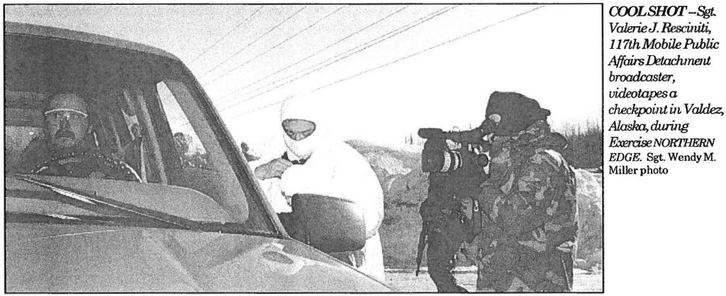 COOL SHOT – Sgt. Valerie J. Resciniti 117th Mobile Public Affairs Detachment, broadcaster, videotapes a checkpoint in Valdez, Alaska, during Exercise NORTHERN EDGE. Sgt. Wendy M. Miller photo