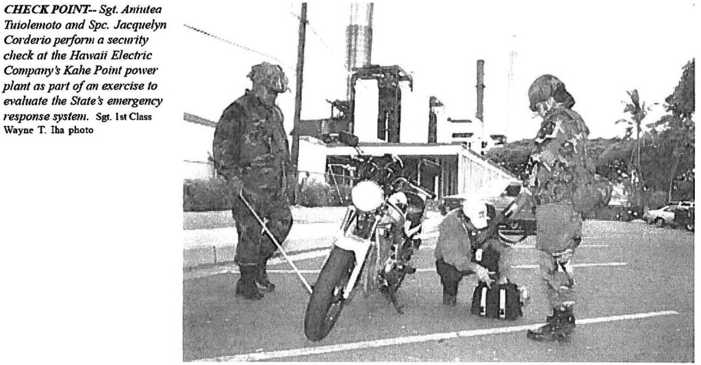 CHECK IT OUT Sgt. Aniutea Tuiolemoto and Spc. Jacquelyn Corderio, 29th Support Battalion soldiers, inspect a motorbiker entering the Hawaiian Electric Company's Kahe power plant during Exercise HO'OPALE ELUA (to defend against). Sgt. 1st Class Wayne T. Iha photo