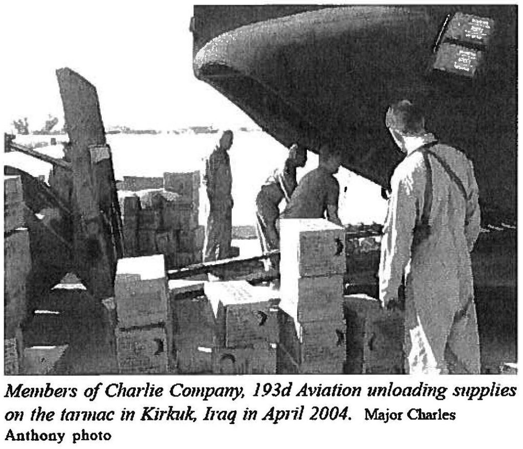 Members of Charlie Company, 193d Aviation unloading supplies on the tarmac in Kirkuk, Iraq in April 2004. Major Charles Anthony photo