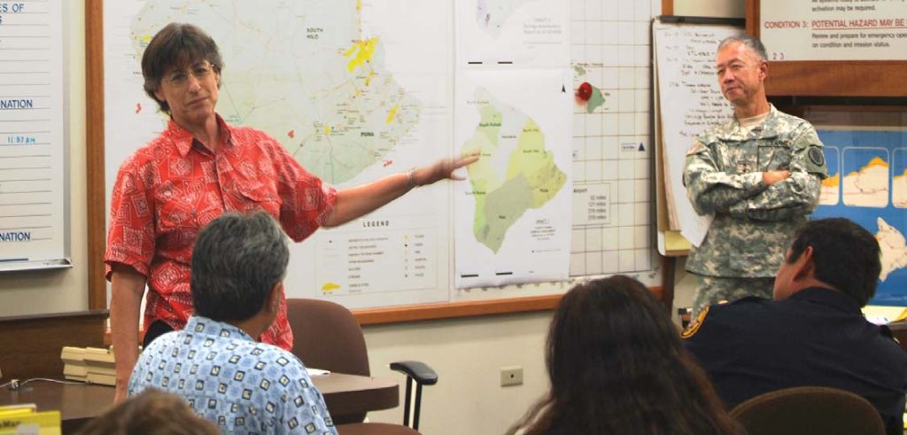 ON THE STOP – Gov. Linda Lingle and Maj. Gen. Robert G.F. Lee go over the earthquake recovery plan in the Hawaii County Emergency Operations Center after the Big Island’s Kiholo Bay 6.7 magnitude quake. Maj. Charles J. Anthony photo