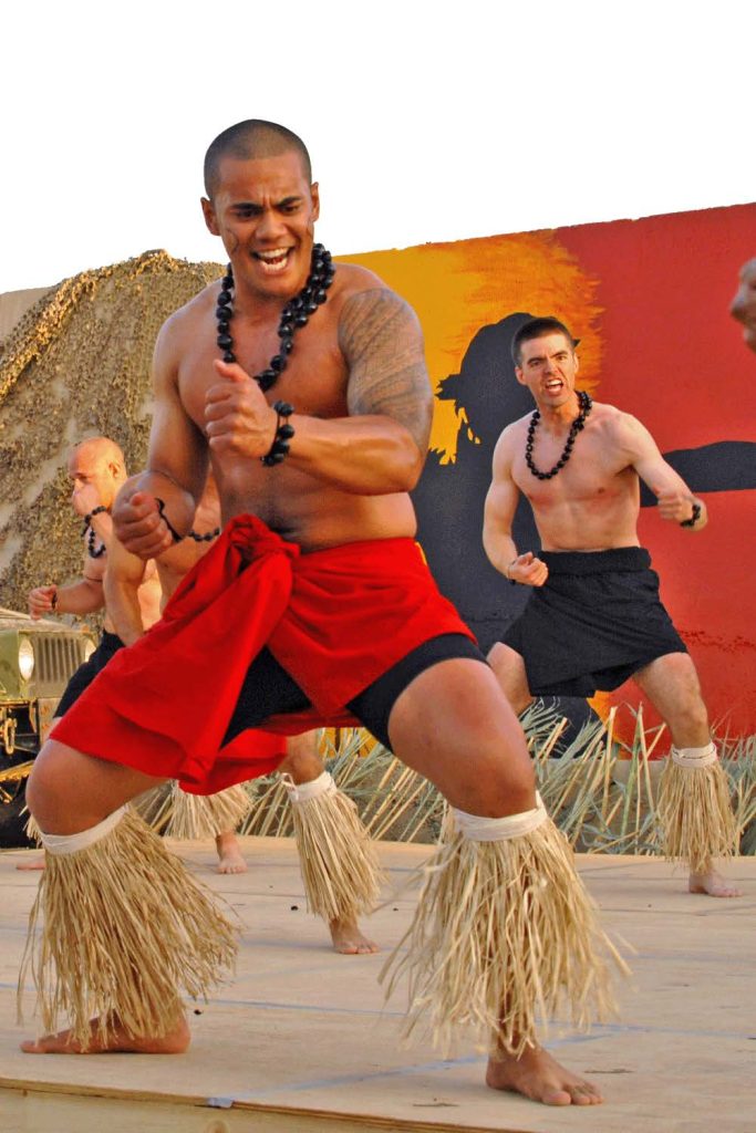 HAKA IN IRAQ – Senior Airman Gabriel Time and Tech. Sgt. Gary Gende from the 506th Air Expeditionary Group, perform a Polynesian haka at the Ho’olaule’a (celebration) held at Kirkuk Air Base. The event was put with the assistance of 201st Combat Communications Group Airmen attached to the 506th. Staff Sgt. Joshua Brecko photo