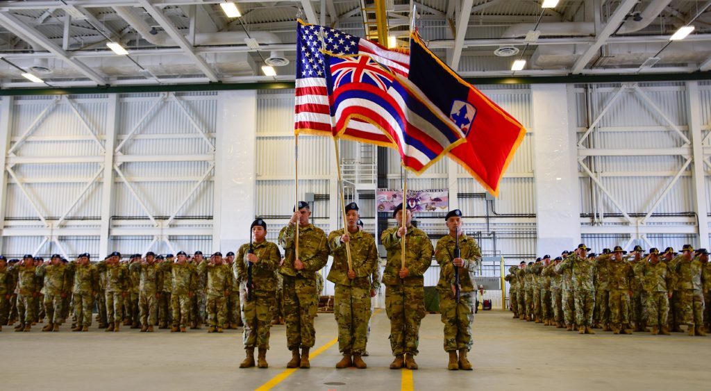 Hawai‘i Army National Guard Soldiers deploy to Egypt and Kosovo, Kapolei, HI. Soldiers from Alpha and Bravo Troops, 1st Squadron, 299th Cavalry Regiment, and elements of the 29th Infantry Brigade Combat Team, render a salute alongside the color guard team during their deployment ceremony to Sinai, Egypt. (Photo by: Sgt. 1st Class Theresa Gualdarama)