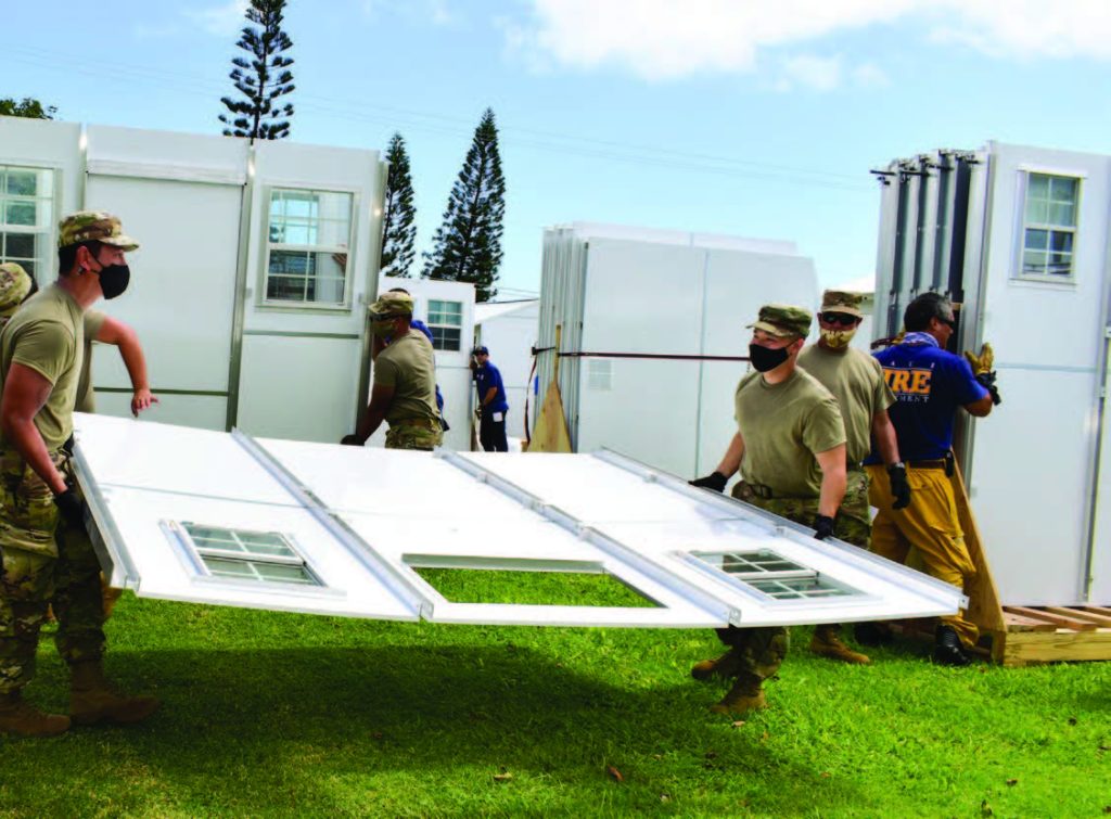 Hawai‘i National Guardsmen assemble temporary shelters during COVID-19 pandemic, Wailuku, HI. Members of the Hawai‘i National Guard, Maui Fire Department, and the Dept. of Parks and Recreation worked together to construct temporary shelters for Maui County residents affected by the COVID-19 pandemic in Wailuku. (Photo by: Sgt. 1st Class Theresa Gualdarama)