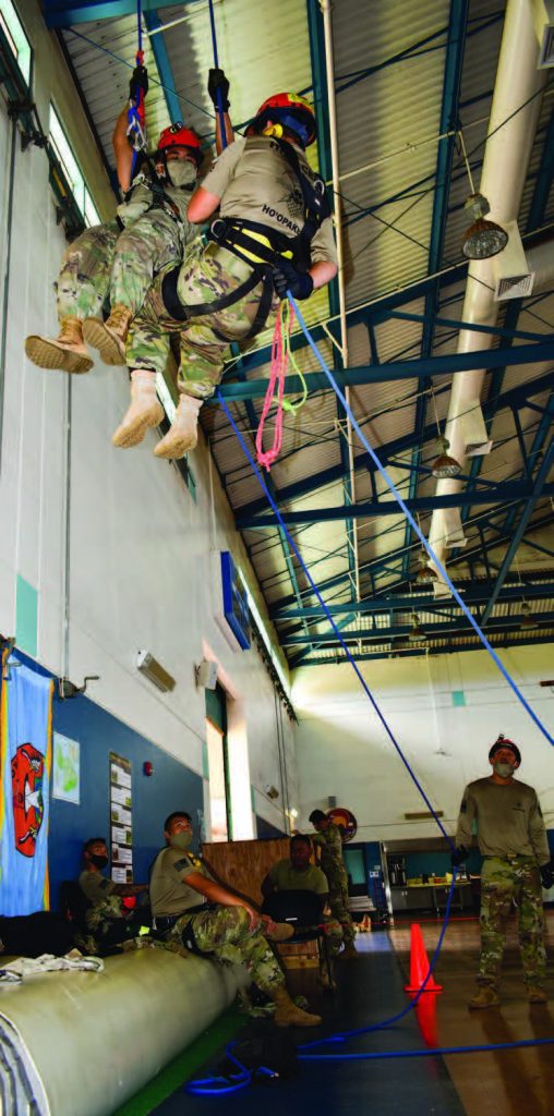 230th Engineers conduct CERFP refresher training during COVID-19 pandemic, Kīhei, HI. Hawai‘i National Guard Soldiers Sgt. Lyndsey Pascual, a heavy equipment operator utilizes her ropes refresher training to descend to the ground during COVID-19 operations on Maui, Kīhei, and Hawai‘i island. This type of training is vital to the search and extraction mission conducted by CERFP. (Photo by: Sgt. 1st Class Theresa Gualdarama)