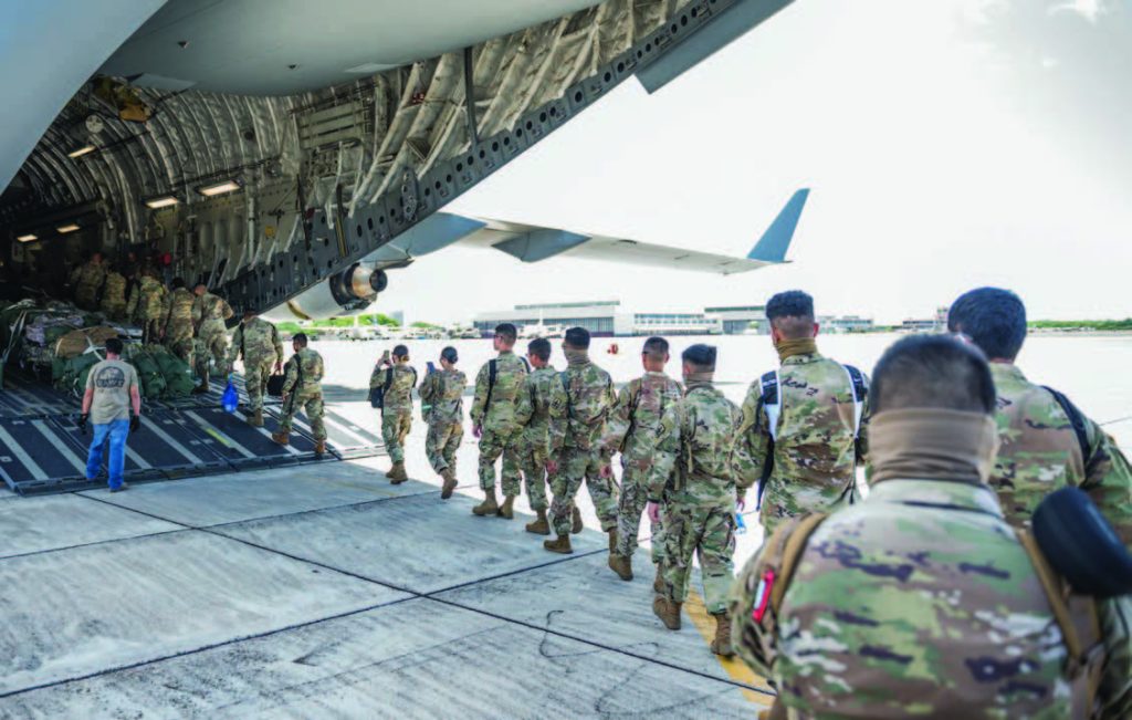 Hawai‘i National Guard COVID-19 neighbor island response, Kalaeloa, HI. Members of the Hawai‘i National Guard board a C-17 to deploy to Maui, Hawai‘i Island, and Kaua‘i, to assist with the state's fight against COVID-19. Over 800 Guardsmen were activated in April. (Photo by: Sgt. John Schoebel)