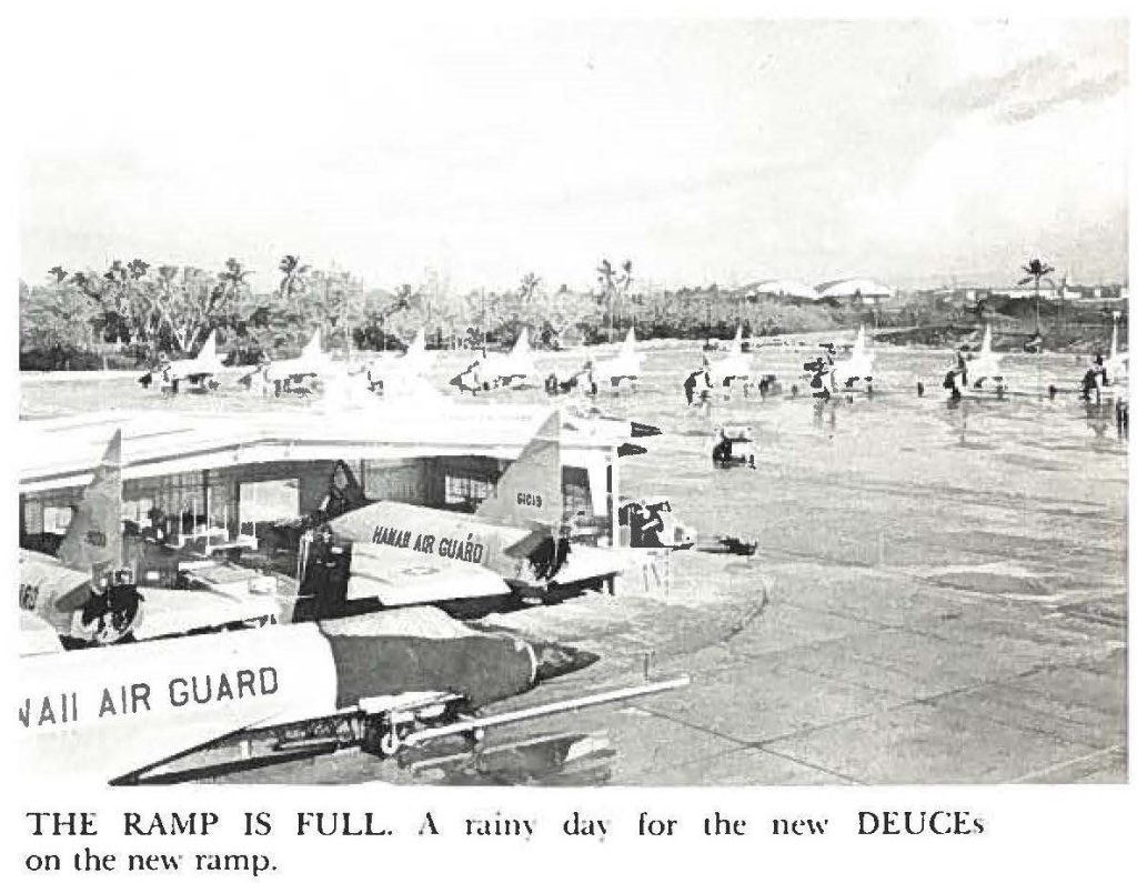 THE RAMP IS FULL. A rainy day for the new DEUCEs on the new ramp.