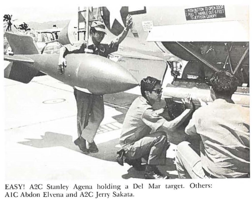 EASY! A2C Stanley Agena holding a Del Mar target. Others: A1C Abdon Ehena and A2C Jerry Sakata.