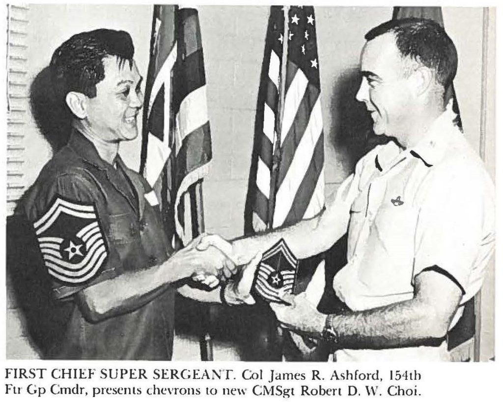 FIRST CHIEF SUPER SERGEANT. Col James R. Ashford, 154th Ftr Gp Cmdr, presents the chevrons to new CMSgt Robert D. W. Choi.