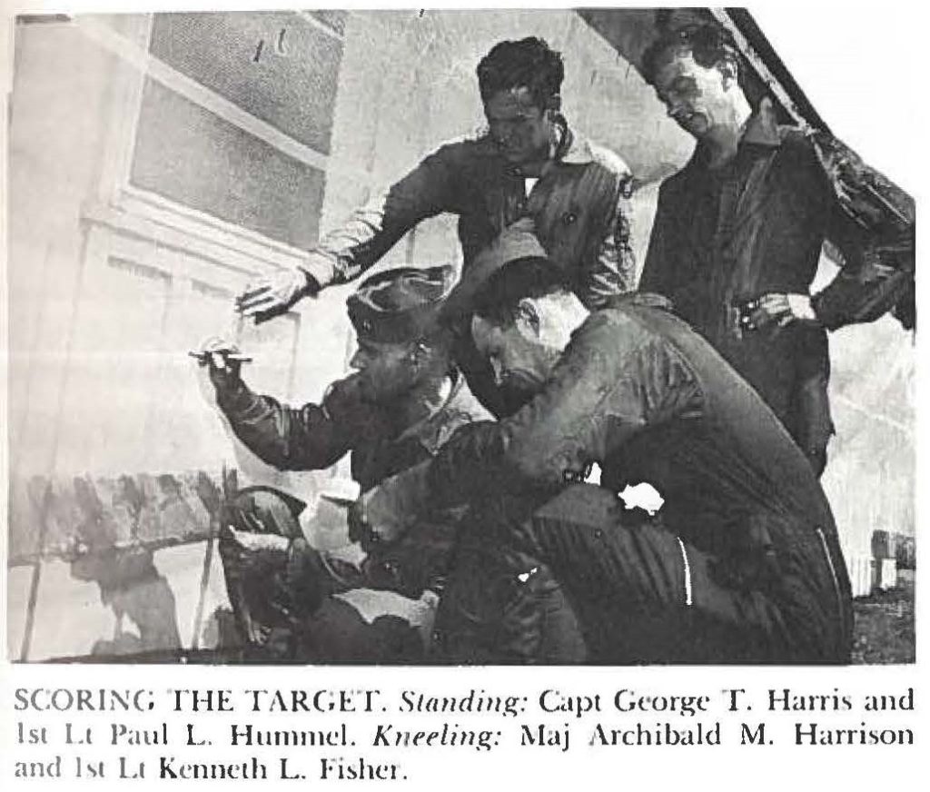 SCORlNG THE TARGET. Standing: Capt George T. Harris and 1st Lt Paul L. Hummel. Kneeling: Maj Archibald M. Harrison and 1st lLt Kenneth L. Fisher.