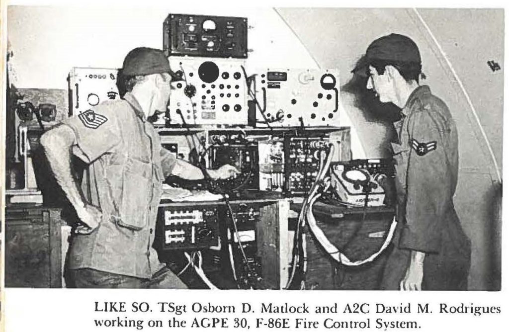 LIKE SO. TSgt Osborn D. Matlock and A2C David M. Rodrigues working on the AGPE 30, F-86E Fire Control System.