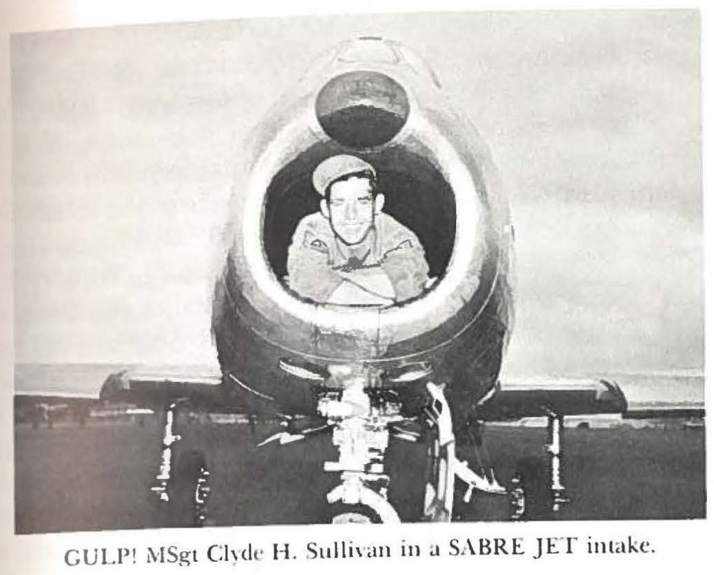 GULP! MSgt Clyde H. Sullivan in a SABRE JET intake.