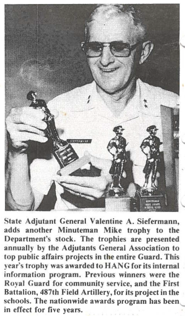 State Adjutant General Valentine A. Siefermann, adds another Minuteman Mike trophy to the Department's stock. The trophies are presented annually by the Adjutants General Association to top public affairs projects in the entire Guard. This year's trophy was awarded to HANG for its internal information program. Previous winners were the Royal Guard for community service, and the First Battalion, 487th Field Artillery, for its project in the schools. The nationwide awards program has been in effect for five years.