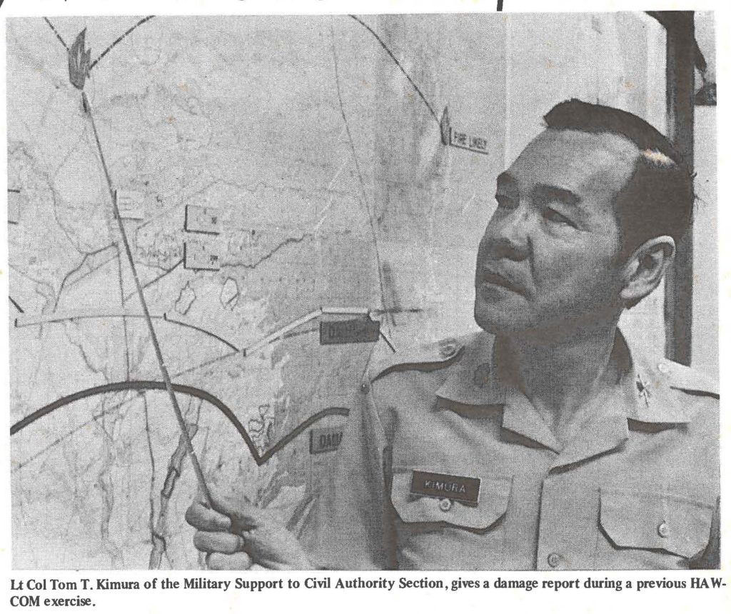 Lt Col Tom T. Kimura of the Military Support to Civil Authority Section, gives a damage report during a previous HAWCOM exercise.