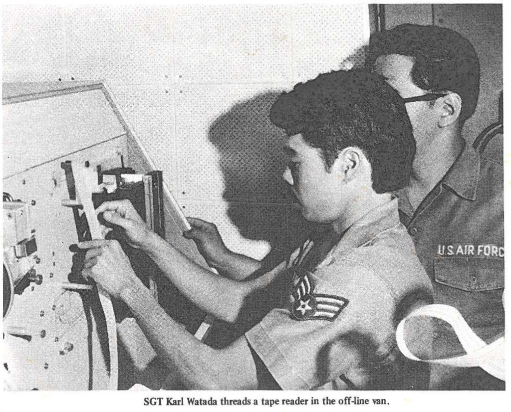 SGT Karl Watada threads a tape reader in the off-line van.