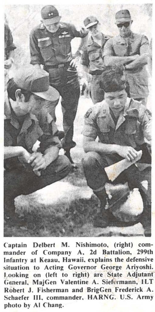 Captain Delbert M. Nishimoto, (right) commander of Company A, 2d Battalion, 299th Infantry at Keaau, Hawaii, explains the defensive situation to Acting Governor George Ariyoshi. Looking on (left to right) are State Adjutant General, MajGen Valentine A. Siefermann, 1LT Robert J. Fisherman and BrigGen Frederick A. Schaefer Ill, commander, HARNG. U.S. Army photo by Al Chang.