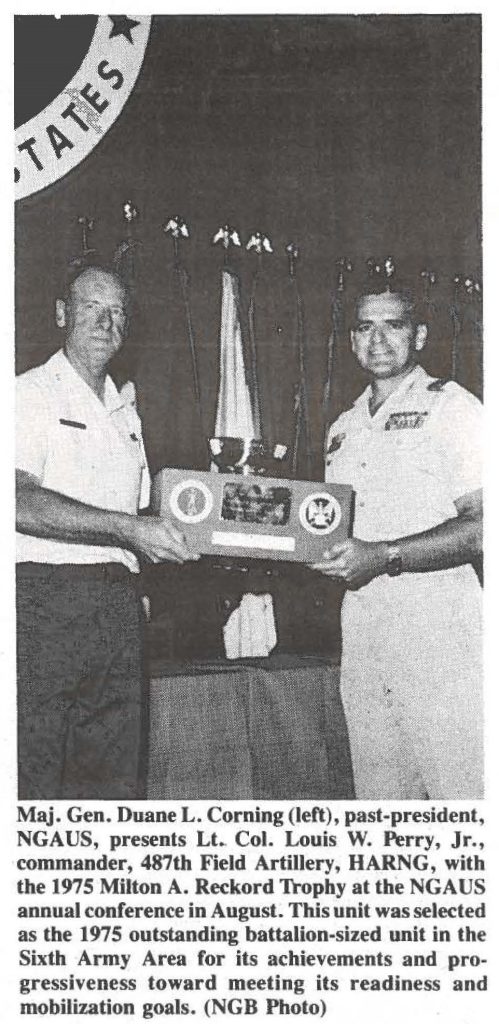 Maj. Gen. Duane L. Corning (left), past-president, NGAUS, presents Lt Col. Louis W. Perry, Jr., commander, 487th Field Artillery, HARNG, with the 1975 Milton A. Reckord Trophy at the NGAUS annual conference in August. This unit was selected as the 1975 outstanding battalion-sized unit in the Sixth Army Area for its achievements and progressiveness toward meeting its readiness and mobilization goals. (NGB Photo)