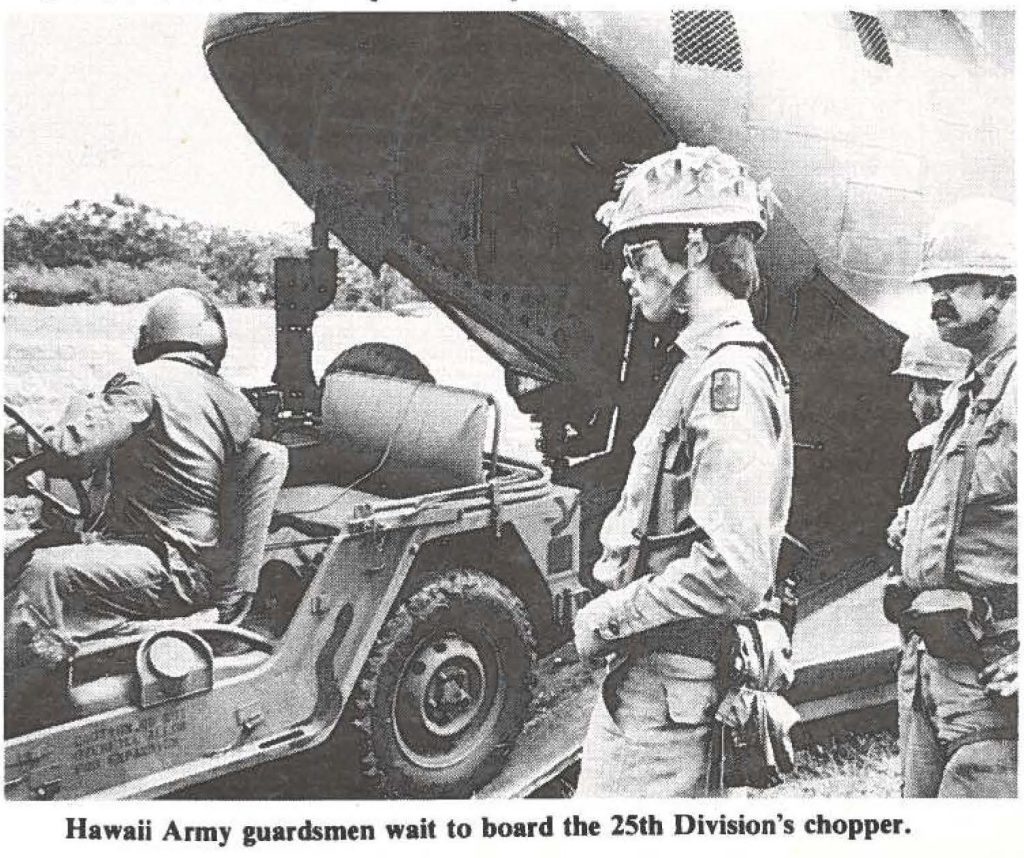 Hawaii Army guardsmen wait to board the 25th Division's chopper.